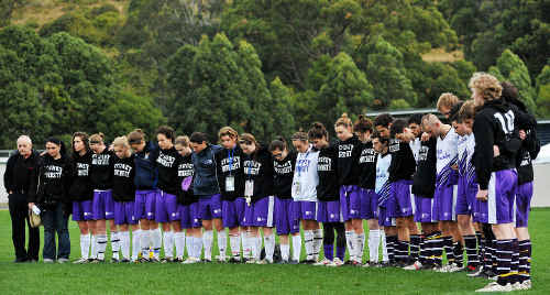 University of Sydney men’s and women’s football teams pause to remember their mate yesterday and inset, the accident scene. University of Sydney men’s and women’s football teams pause to remember their mate yesterday and inset, the accident scene.